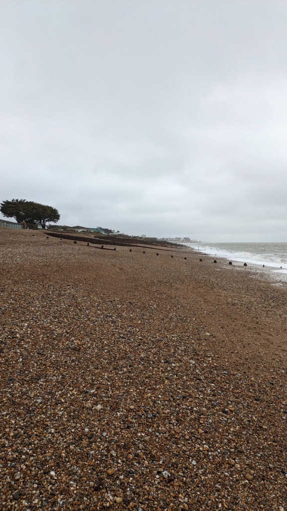 On the beach looking back towards Bognor Regis on a grey cloudy day in April